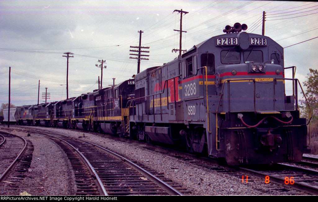 SBD 3288 leads 5 other locos on a southbound train